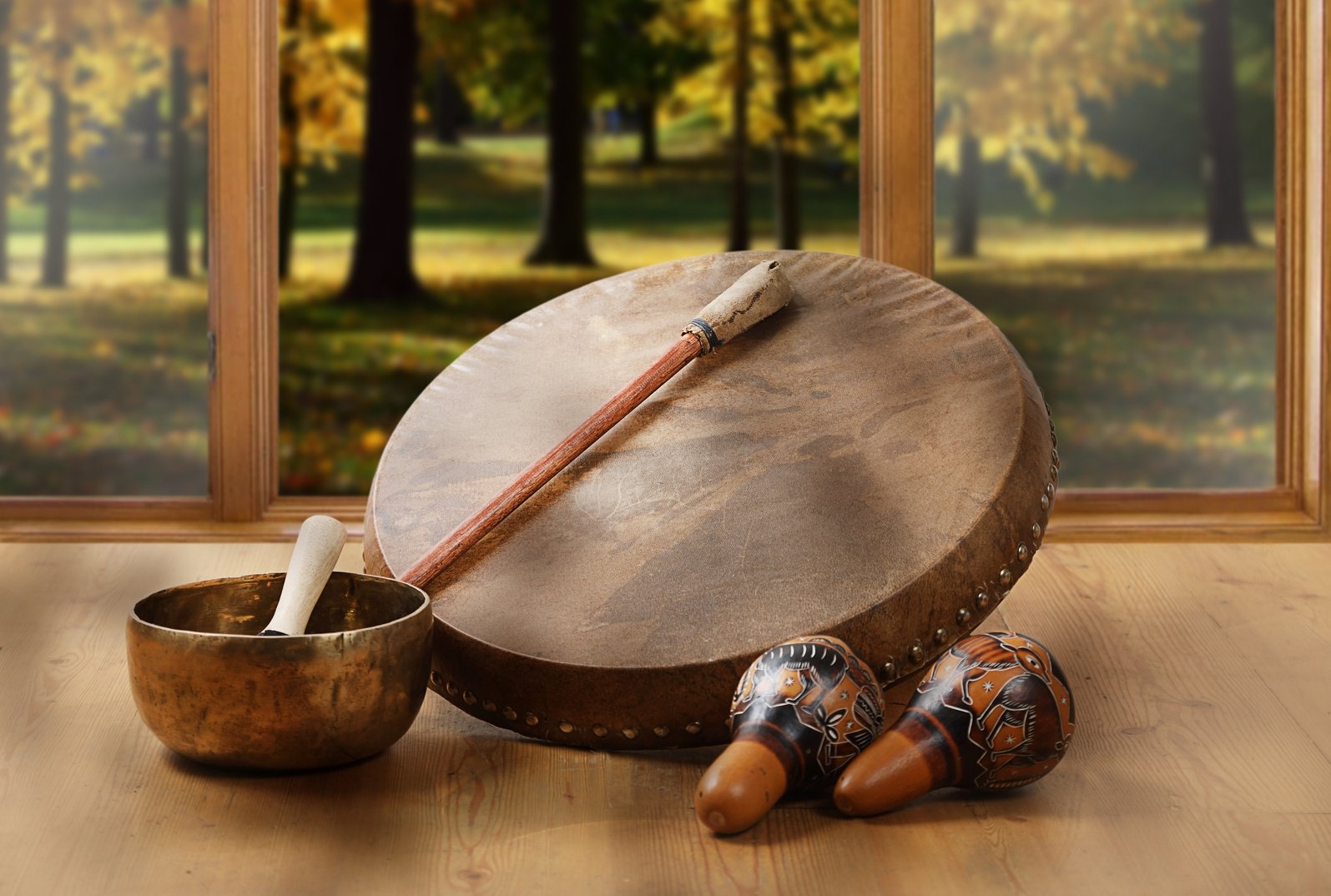 A still life of the shamanic drum, Tibetan singing bowls and maracas